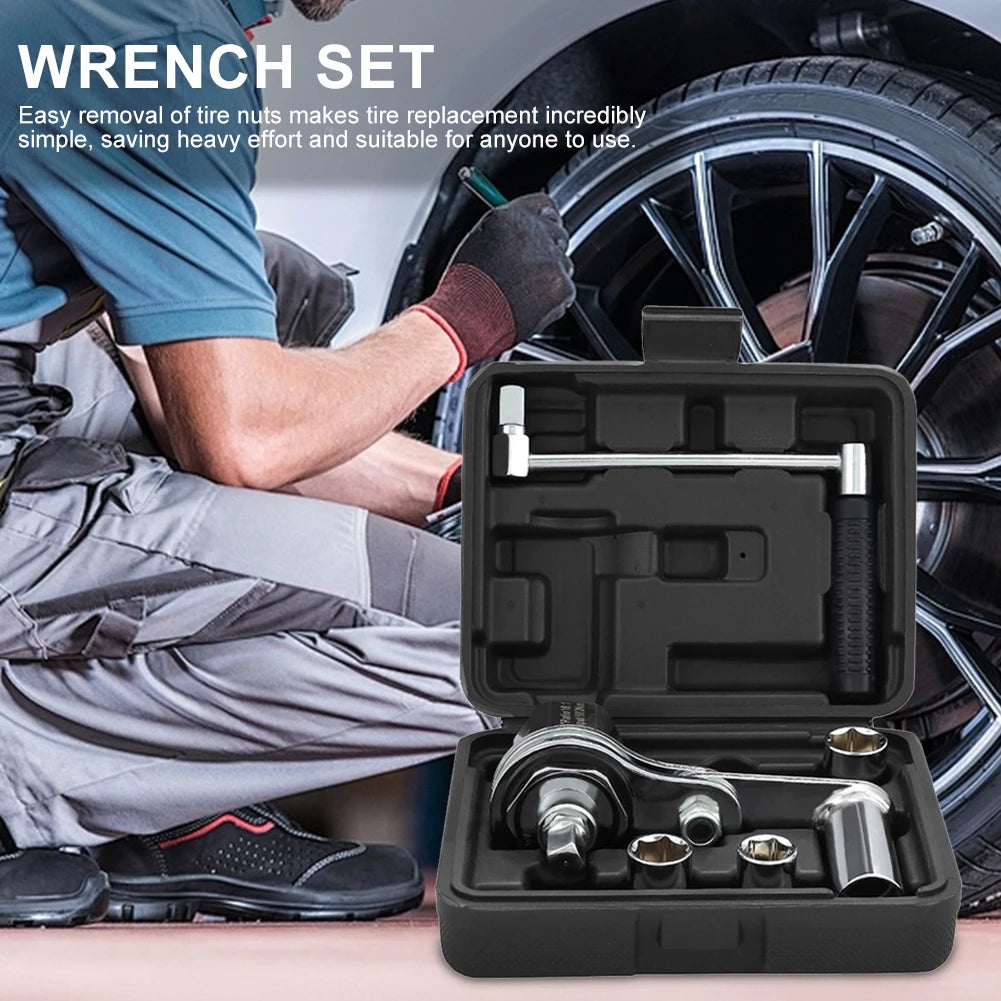 Wrench set with tool case in front of a person changing a tire