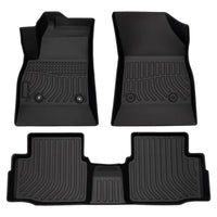 Set of four black car floor mats on a white background