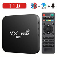 Black MX Pro 5G device with remote control on a white background