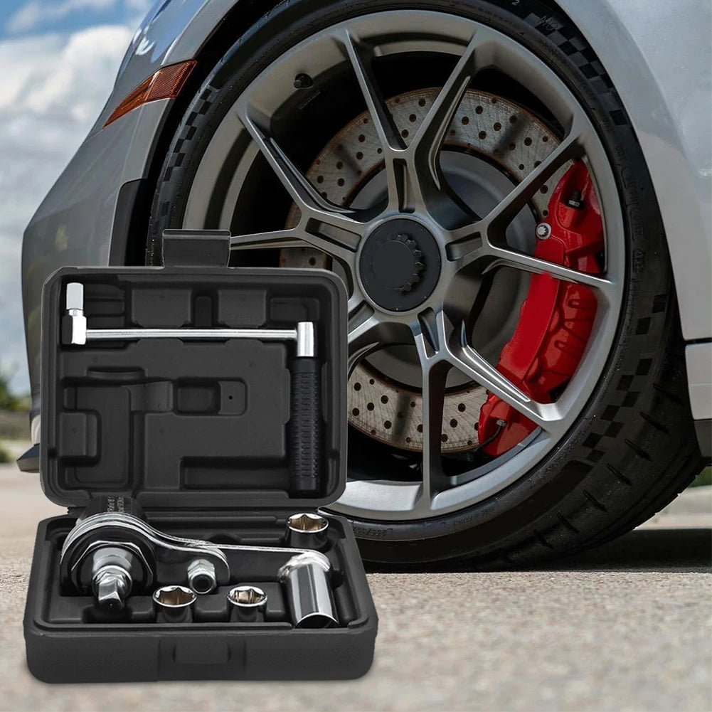 Car wheel with open tool kit on a road