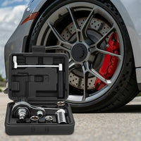 Car wheel with open tool kit on a road