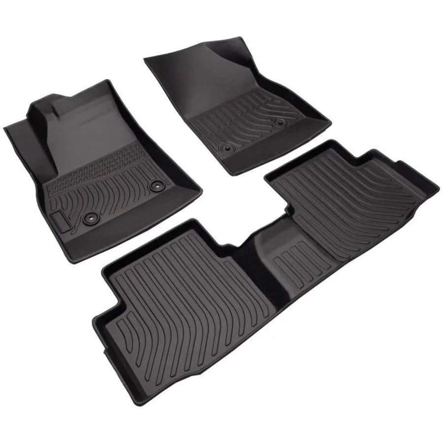 Set of black car floor mats on a white background