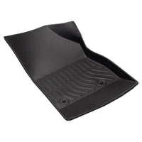 Black car floor mat on a white background