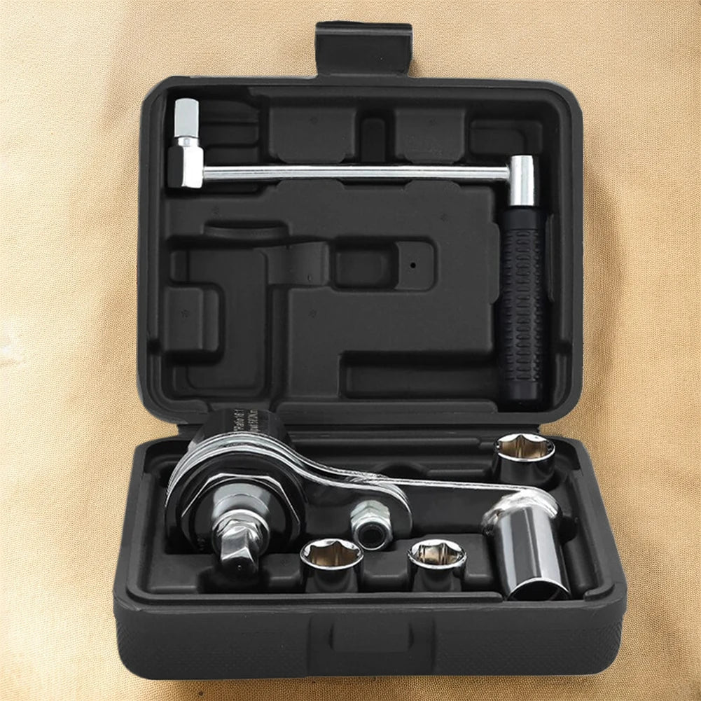 Tool kit with wrenches and sockets in a black case on a beige background