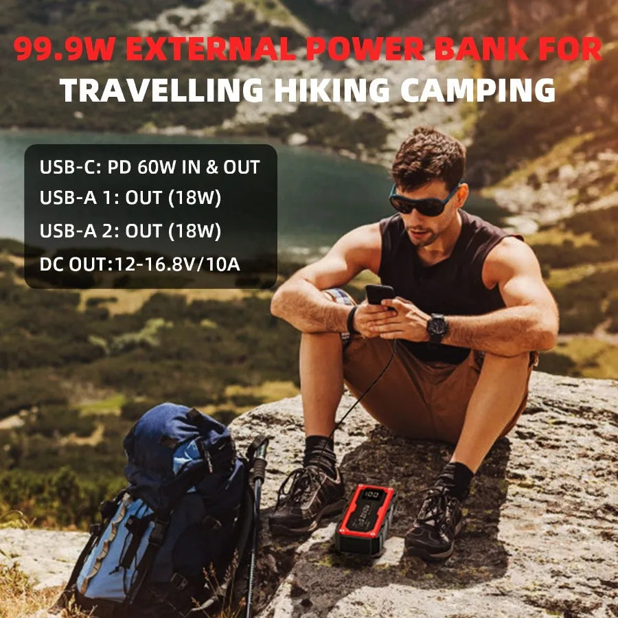 Man sitting on a rock with a power bank, surrounded by nature