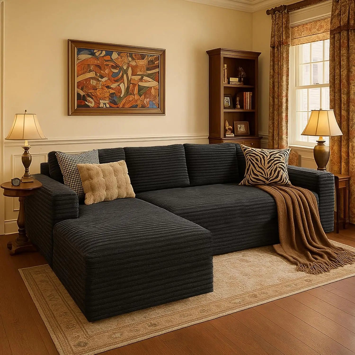 Living room with a dark gray sectional sofa, decorative pillows, and a lamp.