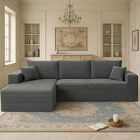 Gray sectional sofa in a living room with decorative elements.